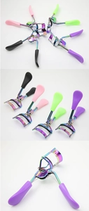 Macro view of portable stainless steel eyelash curler with colorful electroplated finish