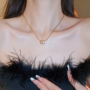 Exquisite gold plated multi-layer zircon cylinder pendant necklace shown on a model's neck
