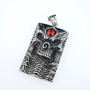 Gothic punk silver square pendant featuring detailed skull with red eye on white background