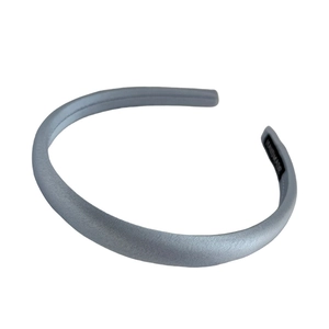Minimalist grey satin headband with handmade label on clean white background
