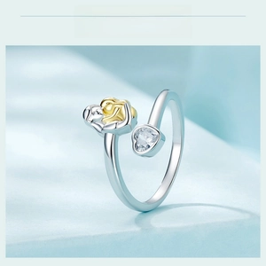 Macro detail of 925 sterling silver mother and child ring with heart cubic zirconia