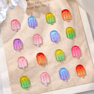 Close-up of 16-piece set of gradient 3D resin ice cream charms for creative nail art DIY