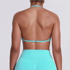 Detailed back view of seamless light blue yoga set with ribbed texture and thin straps