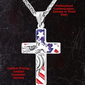 Macro detail of silver cross pendant with American flag enamel and eagle engraving