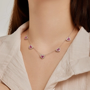 S925 sterling silver heart necklace with pink zircons on elegant female model