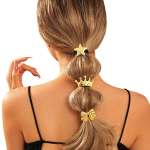Golden metal hair ties set featuring star crown and bow designs on braided hair