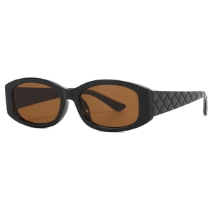 Oval sunglasses with black frames and diamond-patterned temples in a side-view angle