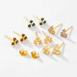 Macro detail of S925 sterling silver stud earring set with multi-color zircon flower clusters