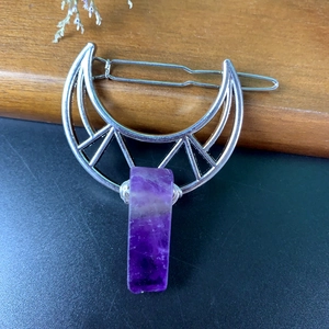 Detailed view of silver moon hair clip with purple natural stone and wire wrapping