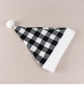 Detailed view of black and white buffalo plaid fabric and fluffy plush trim of a Christmas hat
