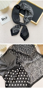 Detail of silk-feel scarf featuring black and white polka dot and paisley pattern mix