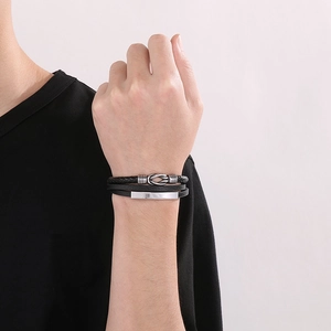 Bracelet pour homme en cuir tressé noir avec fermoir magnétique en métal argenté et nœud