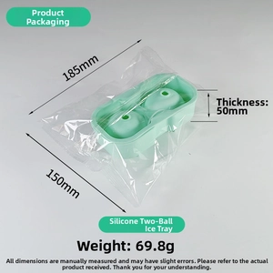 Detail view of silicone dual ice ball mold showing compact plastic packaging and dimensions