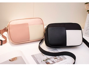 Gros plan sur les sacs de poitrine bicolores en nylon avec fermetures éclair en métal