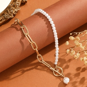 Vintage double-layer bracelet with gold bead chain and white pearls featuring a T-bar OT clasp