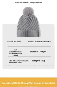 Detailed size chart for the grey acrylic knit beanie with a fluffy pom-pom attachment