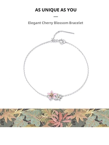 Detail of 925 sterling silver cherry blossom bracelet with pink enamel petals