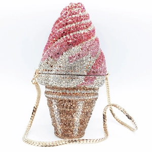 Macro shot of pink and gold crystal rhinestones on an ice cream shaped clutch bag
