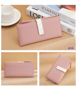 Close-up of pink long wallet with litchi texture leather, gold zipper and strap detail