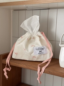 Minimalist cream cotton tissue box cover with pink bows and drawstring closure