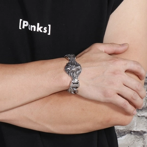 Close-up of vintage wolf head stainless steel bracelet with a punk mechanical chain style