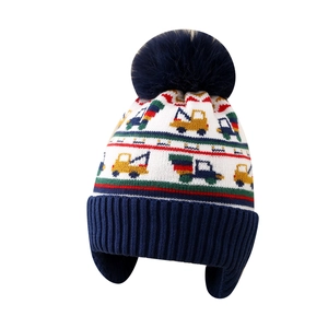 Winter knit hat for boys featuring excavator patterns with warm ear flaps and navy pom
