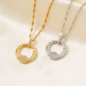 Minimalist twisted circle pendant necklace with micro-pave cubic zirconia in gold and silver