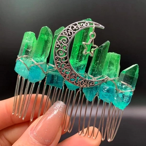 Close-up of handmade crystal hair comb with crescent moon and star pendant detail
