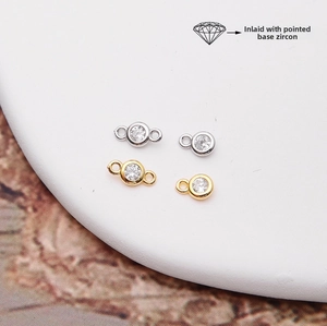 Macro view of 925 silver pendants featuring pointed cubic zirconia in gold and silver