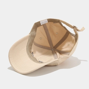 Detail view of 100% cotton baseball cap interior with reinforced seams and metal buckle
