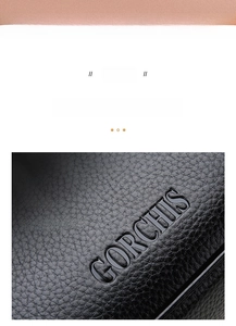 Macro shot of GORCHIS embossed logo on premium black litchi grain leather clutch