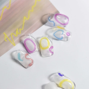 Translucent jelly nail stickers with colorful letters and hearts for a minimalist aesthetic