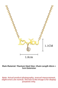 Detailed view of gold titanium necklace with I Love You pendant and sparkling zircon stone