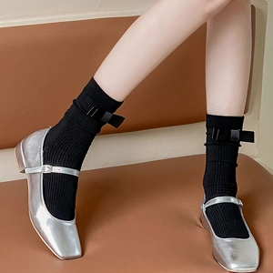 Japanese style black calf socks with sweet bow detail paired with silver Mary Jane shoes