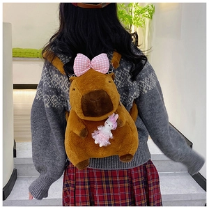 Plush brown capybara backpack with pink plaid bow and a cute rabbit doll charm detail