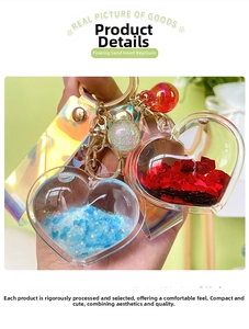 Detailed macro of heart-shaped liquid glitter keychain with laser strap and golden ring