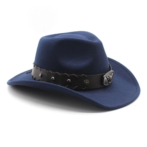 Detail of navy wool felt cowboy hat with leather band and metal bull head buckle decoration
