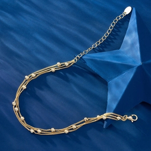 Three-layer 925 sterling silver bead bracelet with golden finish and lobster clasp closure