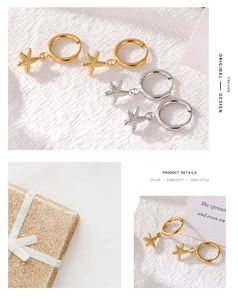 Detail of star-fish pendant earrings in gold and silver finish with gift packaging