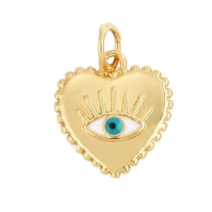 Detailed view of gold-plated heart-shaped pendant with evil eye zircon inlay