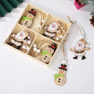 Christmas wooden angel ornaments set with painted Santa and snowmen in a storage box