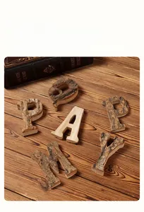 Macro view of rustic natural birch wood letters with real bark on a dark wood background