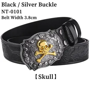Detail of western leather belt with gold skull buckle and vintage embossed texture