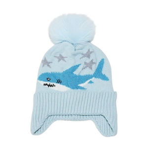 Detail of light blue winter ski hat for boys with shark pattern and fuzzy pompom