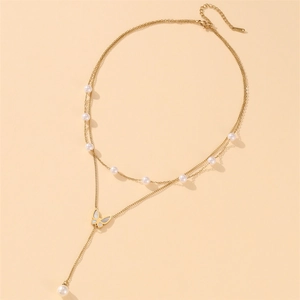 Double-layer gold butterfly necklace with white pearls and long tassel pendant
