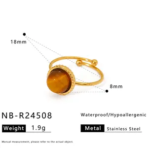 Macro detail of gold plated stainless steel ring with 8mm brown natural stone and dimensions