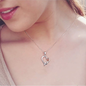 S925 silver heart necklace with rose flower pendant shown on a female model