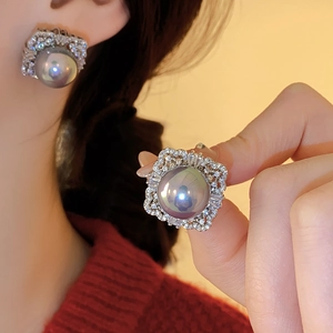 Detail shot of vintage square earrings with grey phantom pearls and zircon crystals