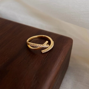 French style gold plated crisscross open ring with shimmering cubic zirconia accents