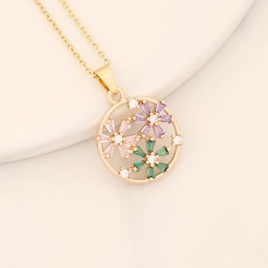 Detail of gold circular pendant with pink, purple and green zircon flower inlay